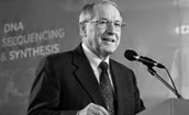 Professor Caruthers speaking at a conference